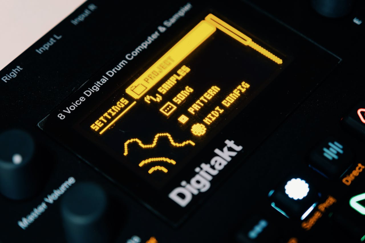 Detailed view of a digital drum computer's illuminated interface showing settings and samples.